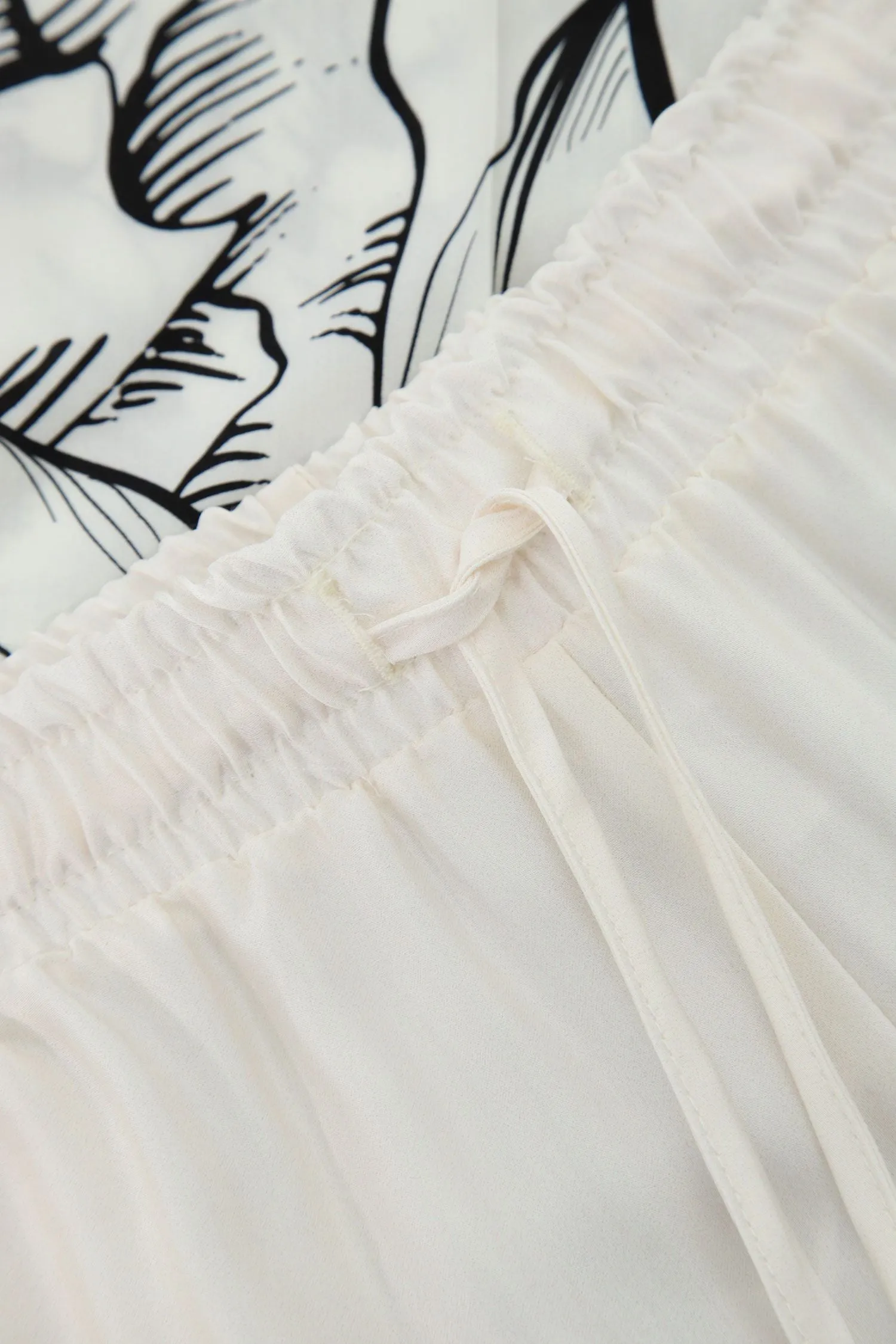 Pantaloni a palazzo con coulisse e parte inferiore floreale IMPERIAL